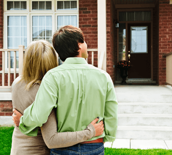 The Spec Home Buying Process Couple in Front of House image
